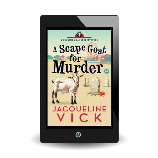 A light tan paperback cover with a fair in the background and several gravestones and a goat in the foreground. The title is A Scape Goat for Murder, a Frankie Chandler mystery, by Jacqueline Vick.